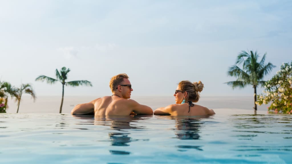 Happy Couple in Infinity Pool